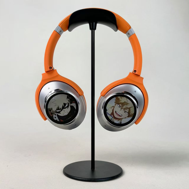 Orange and silver Dual-Screen headphones on a display stand