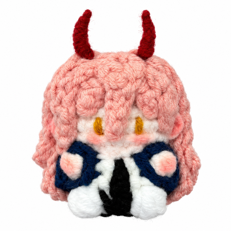 Handmade Chainsaw Man Power crochet charm on a white background