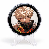 E-Badge Display showing Katsuki Bakugo artwork on a clear photography stand
