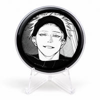 E-Badge Display showing black and white manga artwork on a clear photography stand